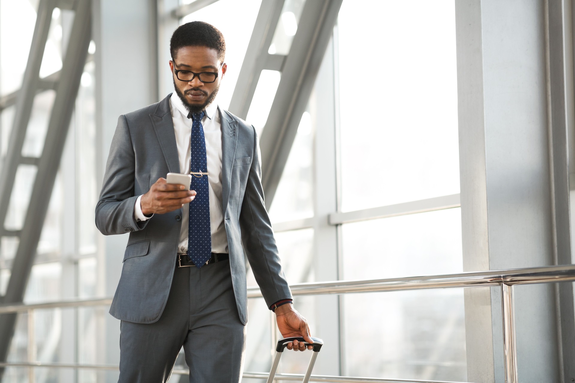 Businessman Texting On Smartphone In Airport Indoor Making Business Trip